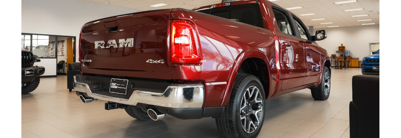 Rear view of RAM 1500 showing towing hitch setup for travel trailer use